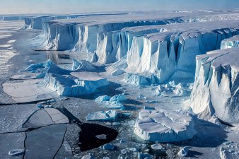 Massive glacial cliffs of Severnaya Zemlya meeting the frozen Kara Sea